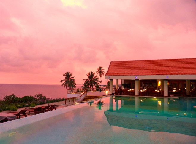 Pink-sunset-by-Leela-Hotel-pool